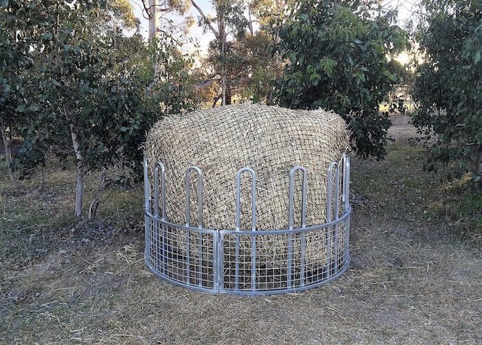 GutzBusta Knotted Hay Nets - Round Bales-in cage